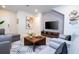 Bright and airy living space featuring a contemporary rug, cozy seating, and a functional layout for comfort and style at 3428 Lilac Way, Davenport, FL 33897