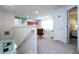 Upstairs loft featuring a comfortable chair, soft carpet and natural light at 3428 Lilac Way, Davenport, FL 33897