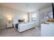 Relaxing main bedroom featuring a king bed, geometric accent wall, and natural light at 3428 Lilac Way, Davenport, FL 33897
