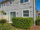 A private outdoor space featuring a sliding glass door and a lush green hedge at 3593 Brighton Park Cir, Belle Isle, FL 32812
