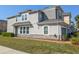 Beautiful townhome with stone accents, well-kept lawn, and attached garage at 3593 Brighton Park Cir, Belle Isle, FL 32812