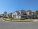 Charming townhomes with well-maintained landscaping, beautiful stonework, and two-car garages at 3593 Brighton Park Cir, Belle Isle, FL 32812