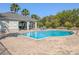 Resort-style pool area featuring a gazebo and comfortable lounge chairs at 3593 Brighton Park Cir, Belle Isle, FL 32812