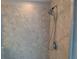 An elegantly tiled shower stall featuring a modern shower head and hardware at 3593 Brighton Park Cir, Belle Isle, FL 32812