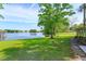 Expansive backyard with mature tree, lakeside view, perfect for relaxation and outdoor enjoyment at 409 Oak Haven Dr # 409, Altamonte Springs, FL 32701