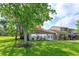 Expansive backyard features lush lawn, mature trees, and an outdoor patio at 409 Oak Haven Dr # 409, Altamonte Springs, FL 32701