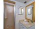 Bathroom with a shower, marble vanity, framed mirror, and tiled wall at 409 Oak Haven Dr # 409, Altamonte Springs, FL 32701