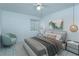 Stylish bedroom with a ceiling fan, modern decor, a plush bed, and a cozy seating area at 409 Oak Haven Dr # 409, Altamonte Springs, FL 32701