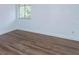 Bedroom with luxury vinyl flooring, a bright window, and crisp white baseboards at 409 Oak Haven Dr # 409, Altamonte Springs, FL 32701
