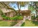 Inviting single-story home with brick facade, manicured landscaping, and a cozy front porch at 409 Oak Haven Dr # 409, Altamonte Springs, FL 32701