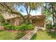 Inviting single-story home with brick facade, manicured landscaping, and a cozy front porch at 409 Oak Haven Dr # 409, Altamonte Springs, FL 32701