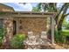 Cozy front porch with seating area, decorative chairs, and brick accents at 409 Oak Haven Dr # 409, Altamonte Springs, FL 32701