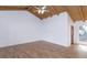 Living room features tile floors, vaulted ceilings and a door by the front entryway at 409 Oak Haven Dr # 409, Altamonte Springs, FL 32701