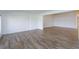 Spacious living area with wood-look tile flooring and neutral paint throughout, perfect for entertaining at 409 Oak Haven Dr # 409, Altamonte Springs, FL 32701