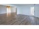 Bright living room featuring beautiful wood-look tile flooring and a rear exterior door to allow natural light at 409 Oak Haven Dr # 409, Altamonte Springs, FL 32701