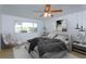 Stylish main bedroom with large window, modern decor, and ample natural light overlooking the water at 409 Oak Haven Dr # 409, Altamonte Springs, FL 32701