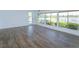 Bright sunroom features large windows showcasing beautiful landscaping and a glimpse of the lake at 409 Oak Haven Dr # 409, Altamonte Springs, FL 32701