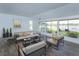 Inviting sunroom with modern furnishings and expansive windows offering picturesque waterfront views at 409 Oak Haven Dr # 409, Altamonte Springs, FL 32701