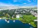 Breathtaking aerial view of waterfront community with lush landscaping and beautiful pool area at 4268 Lake Underhill Rd # 4, Orlando, FL 32803