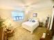 Bright bedroom featuring a ceiling fan, neutral walls, a window, and a comfortable bed at 4268 Lake Underhill Rd # 4, Orlando, FL 32803