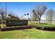 Community sign for Plantation Garden Condominiums, with lush greenery and trees at 4268 Lake Underhill Rd # 4, Orlando, FL 32803