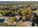 Aerial view of property with boundaries, showcasing home and surrounding trees at 46 Smyrna Dr, Debary, FL 32713