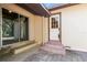 Back entrance with sliding glass door and multi-paned door and steps down to yard at 46 Smyrna Dr, Debary, FL 32713