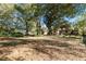 Large backyard with mature trees and playset at 46 Smyrna Dr, Debary, FL 32713