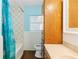 Bathroom features a shower/tub combo, wooden vanity, and light blue walls at 46 Smyrna Dr, Debary, FL 32713