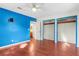 Bright bedroom with hardwood floors and a view to the attached bathroom at 46 Smyrna Dr, Debary, FL 32713