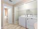 Laundry room with washer, dryer, and wire shelving at 46 Smyrna Dr, Debary, FL 32713