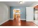Cozy living room featuring hardwood floors with an archway to the kitchen at 46 Smyrna Dr, Debary, FL 32713
