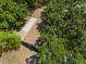 Overhead view of a home featuring a brown shingle roof and mature trees at 4907 Lindsay Ct, Orlando, FL 32821