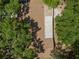 Home with brown roof and bright trees at 4907 Lindsay Ct, Orlando, FL 32821