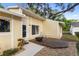 Exterior view of house showcasing patio, fire pit, and landscaped backyard at 4907 Lindsay Ct, Orlando, FL 32821