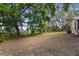Expansive backyard with mature trees offering ample shade and privacy at 4907 Lindsay Ct, Orlando, FL 32821