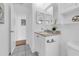 Bathroom featuring a vanity with a granite countertop, modern hardware, and a framed mirror with a tiled floor at 4907 Lindsay Ct, Orlando, FL 32821