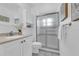 Bright bathroom featuring a shower, vanity with a granite countertop, and a framed mirror with a tiled floor at 4907 Lindsay Ct, Orlando, FL 32821