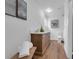 Bright bathroom featuring a wood vanity with a white countertop and decorative accents at 4907 Lindsay Ct, Orlando, FL 32821