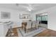Dining room with hardwood floors, stylish seating, and access to the lanai at 4907 Lindsay Ct, Orlando, FL 32821