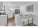 Modern kitchen featuring stainless steel appliances, granite countertops, a window view, breakfast bar and contemporary lighting at 4907 Lindsay Ct, Orlando, FL 32821