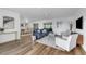 Bright living room featuring hardwood floors, recessed lighting, and modern furniture at 4907 Lindsay Ct, Orlando, FL 32821