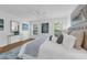 A main bedroom featuring a ceiling fan, hardwood floors, and plenty of natural light at 4907 Lindsay Ct, Orlando, FL 32821