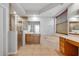 Well-lit primary bathroom with a soaking tub, glass shower, and wooden cabinets at 5055 Coveview Dr, St Cloud, FL 34771