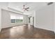 Large bedroom with ample natural light, ceiling fan, and private outdoor access at 5055 Coveview Dr, St Cloud, FL 34771