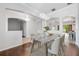 Bright dining room featuring modern chandelier and view into living spaces at 5055 Coveview Dr, St Cloud, FL 34771
