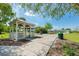 Charming gazebo with seating along a scenic walking path surrounded by lush landscaping and greenery at 5055 Coveview Dr, St Cloud, FL 34771