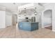 Spacious kitchen with blue island, stainless steel appliances, and modern pendant lighting at 5055 Coveview Dr, St Cloud, FL 34771