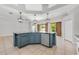 Kitchen island featuring stainless steel dishwasher, pendant lighting, and blue cabinetry at 5055 Coveview Dr, St Cloud, FL 34771