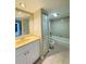 Well-lit bathroom featuring a vanity with a large mirror and a combined bathtub and shower at 5268 Middle Ct # 111, Orlando, FL 32811